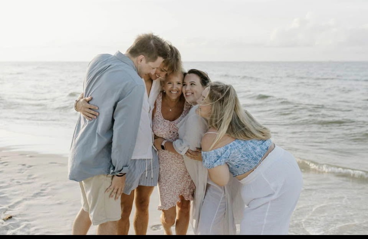 The family today, huddled together at the beach