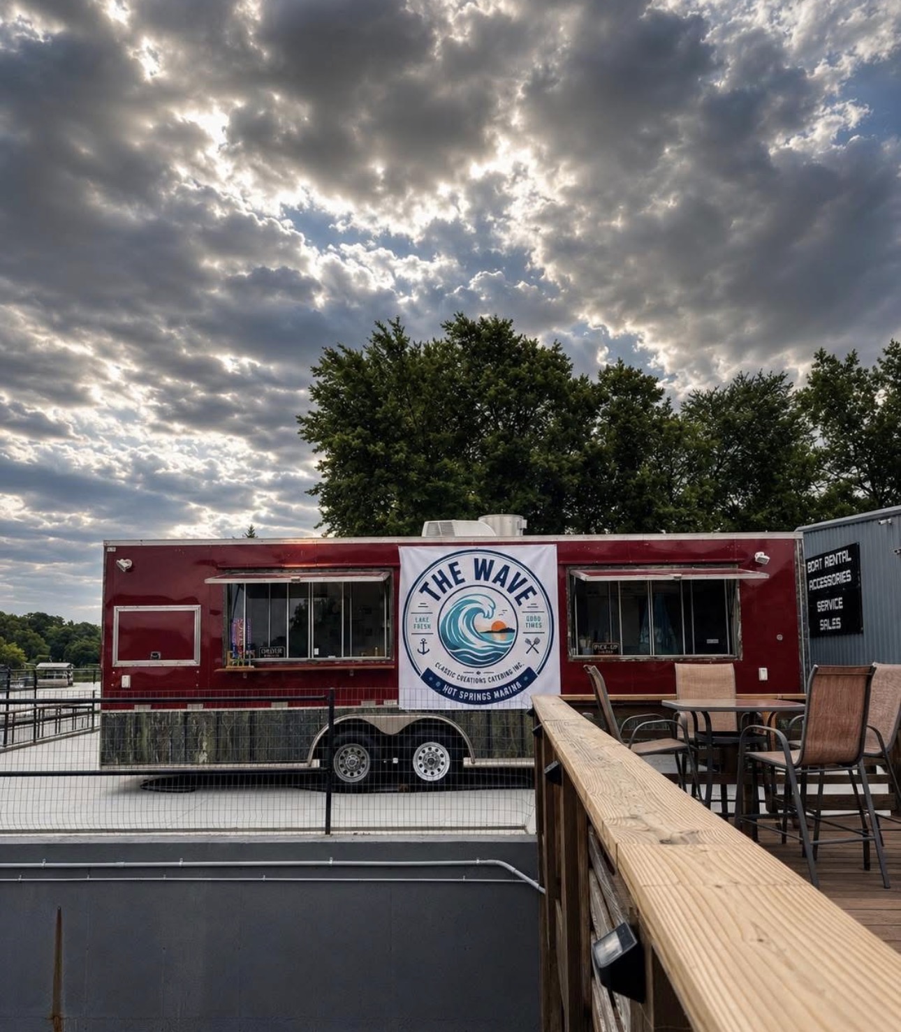 The Wave at Hot Springs Marina under a dramatic sky